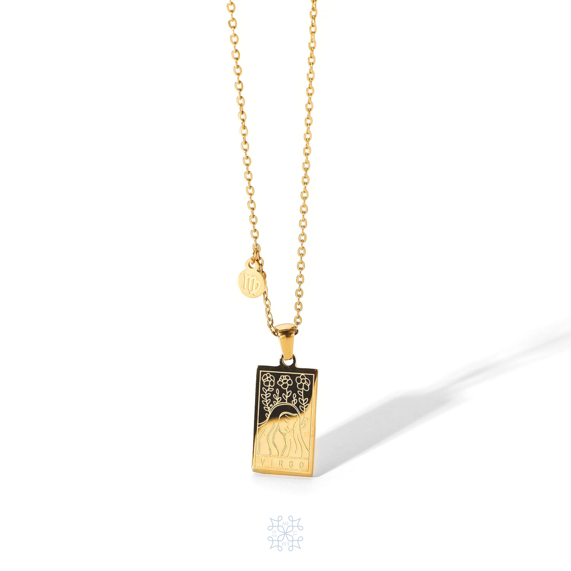 Rectangular gold pendant with a woman engraved representing virgo and the word virgo in the bottom. Gold pendant with a chain necklace. In the side of the gold pendant is a circle small medalion with the symbol of virgo engraved on it. Virgo zodiac pendant gold necklace.