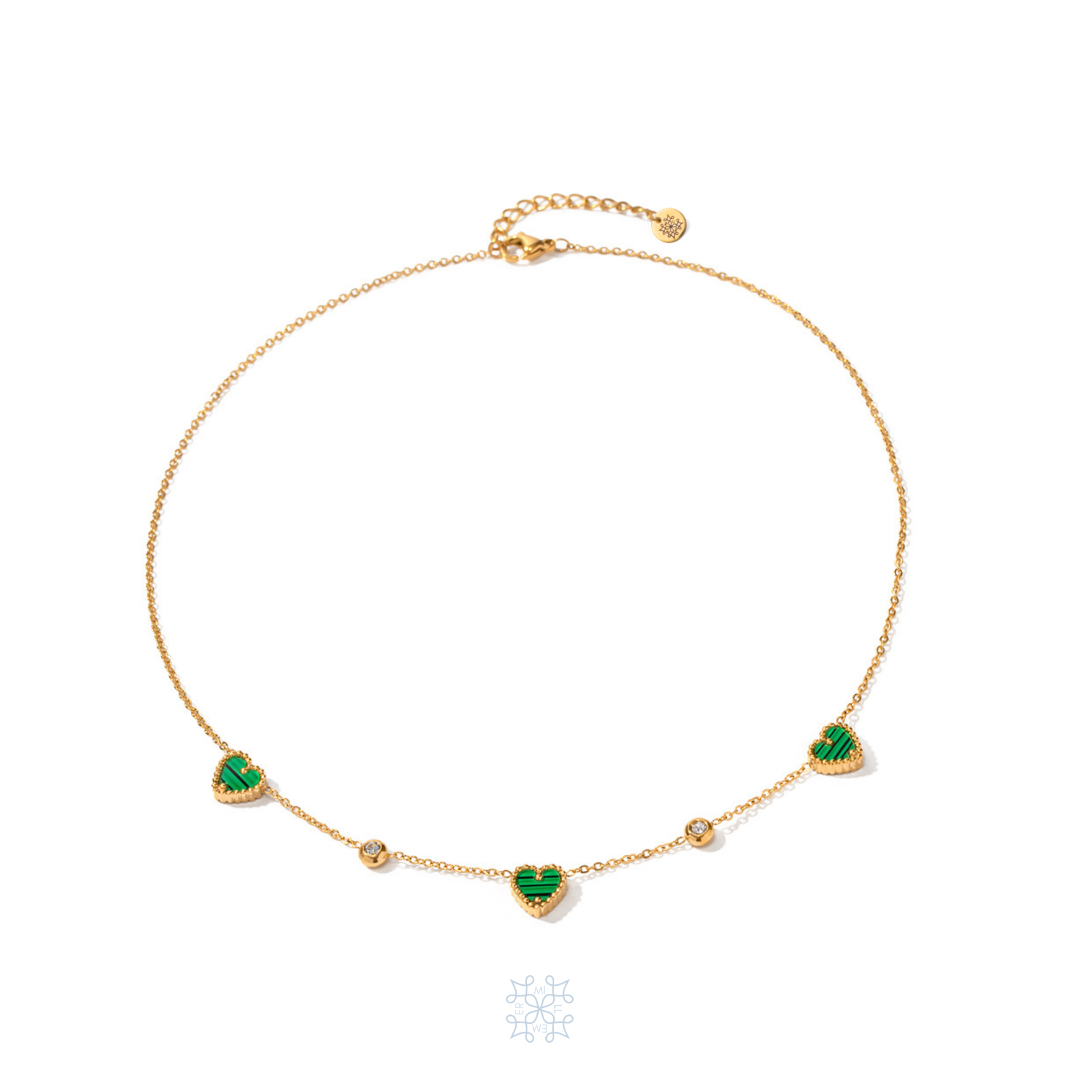 AMORE Malachite Heart Gold Necklace. Three green malachite stones heart shape necklace. Two zircons attached at the chain separating the three hearts.