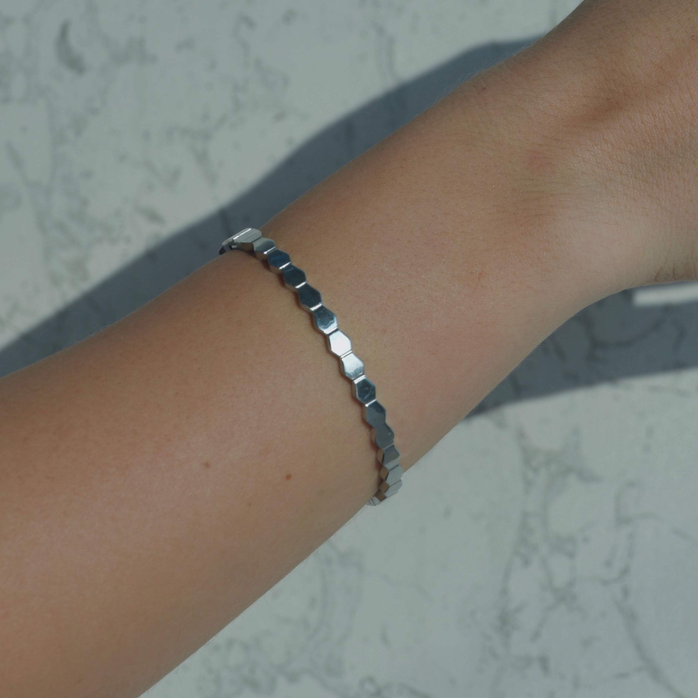 Silver bangle bracelet. Bee hive silver attched with one another creating a circle bracelet