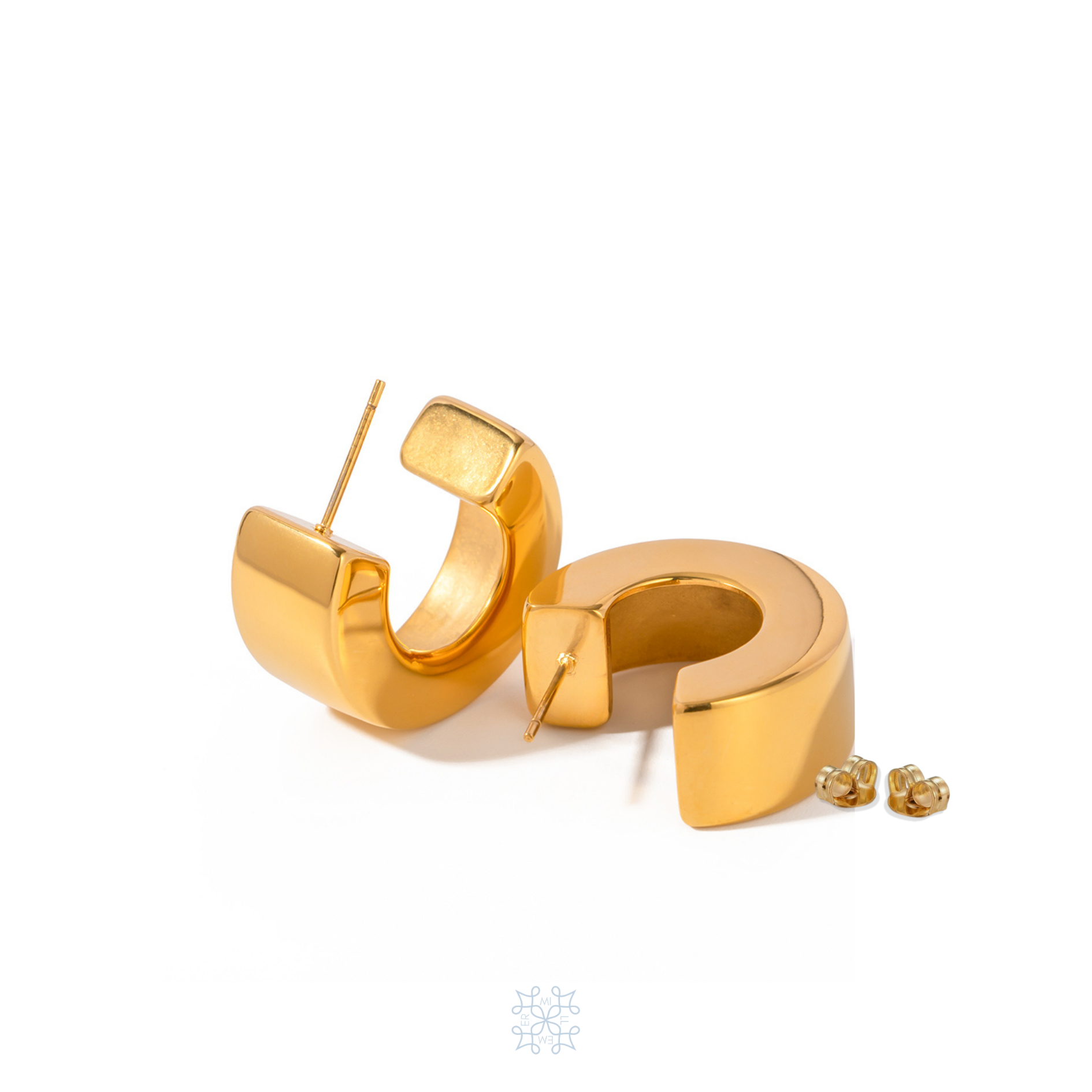 Geometric Gold Hoop Earrings. in the form of a bold geometric hoop.