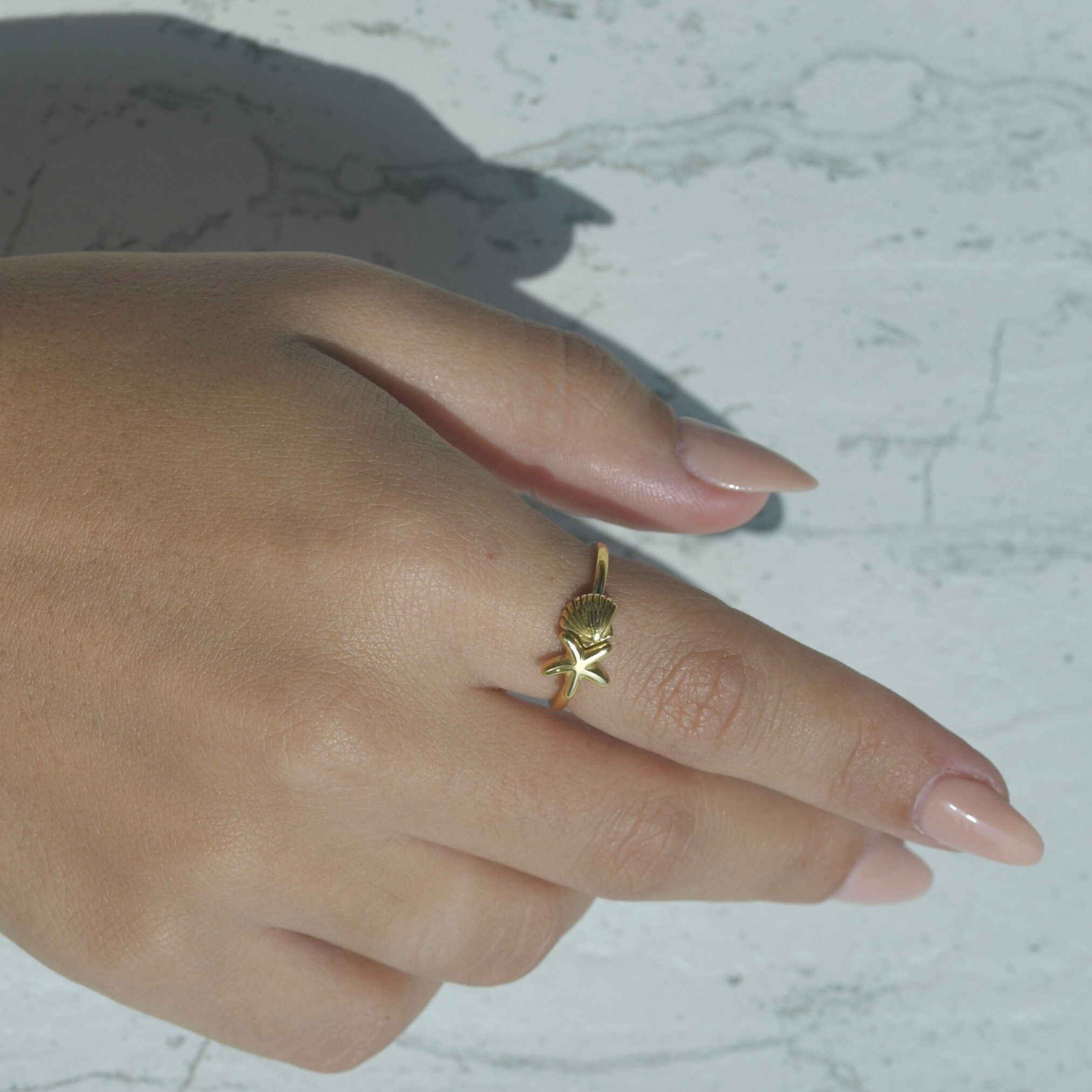 Gold plated ring. A star and a shell on the top of the halo ring. Elegant ring. Caribbean star shell gold ring.