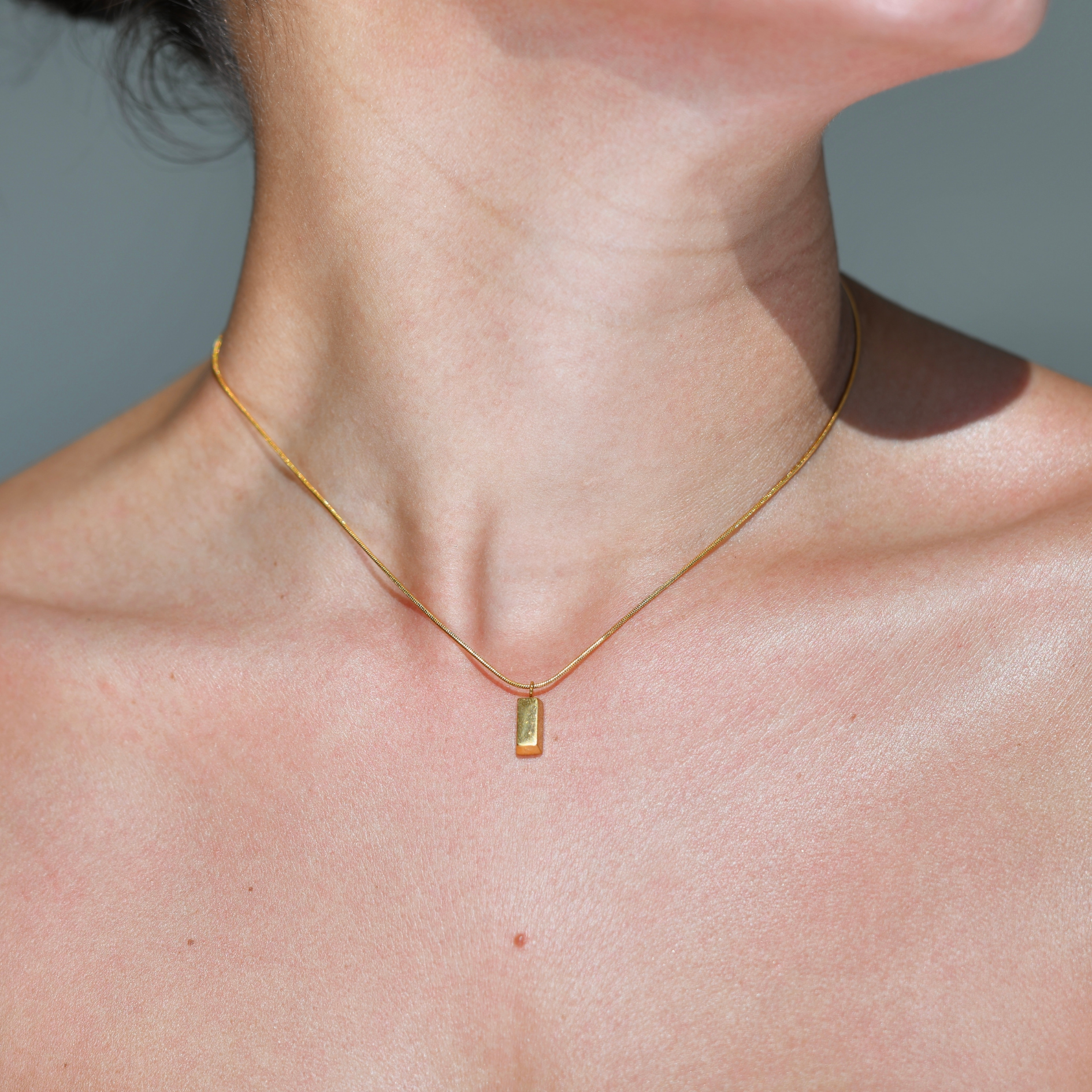 Gold plated chain necklace. A gold bar drop in the necklace. Gold bar pendant necklace.