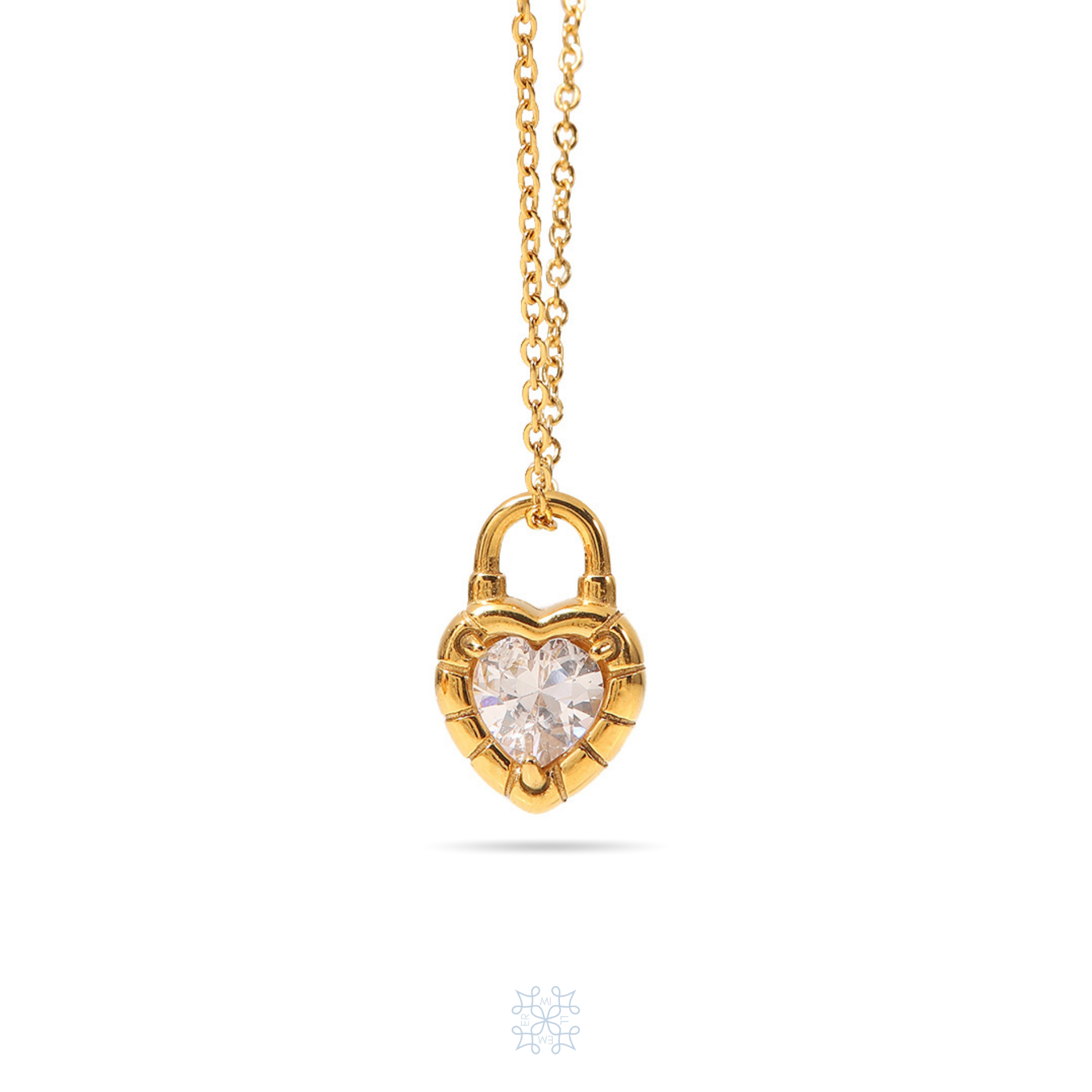 HEARTLOCK Zircon Pendant Gold Necklace. Gold chain with a locker pendnat in the form of a heart. In the middle of the gold heart pendnat is a white zircon stone.