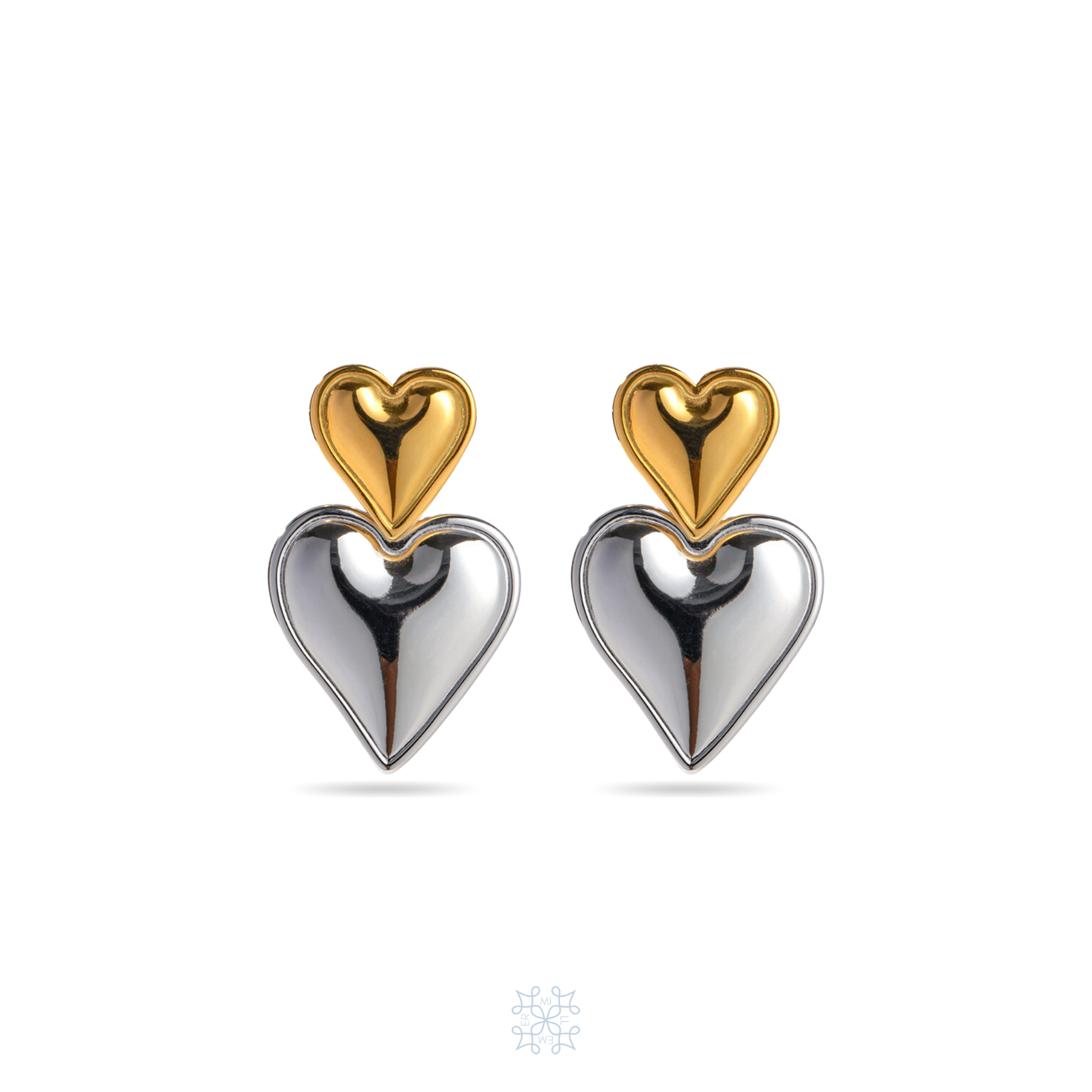 Double Heart Earrings in Silver Heart in the bottom and smaller gold heart in the top.