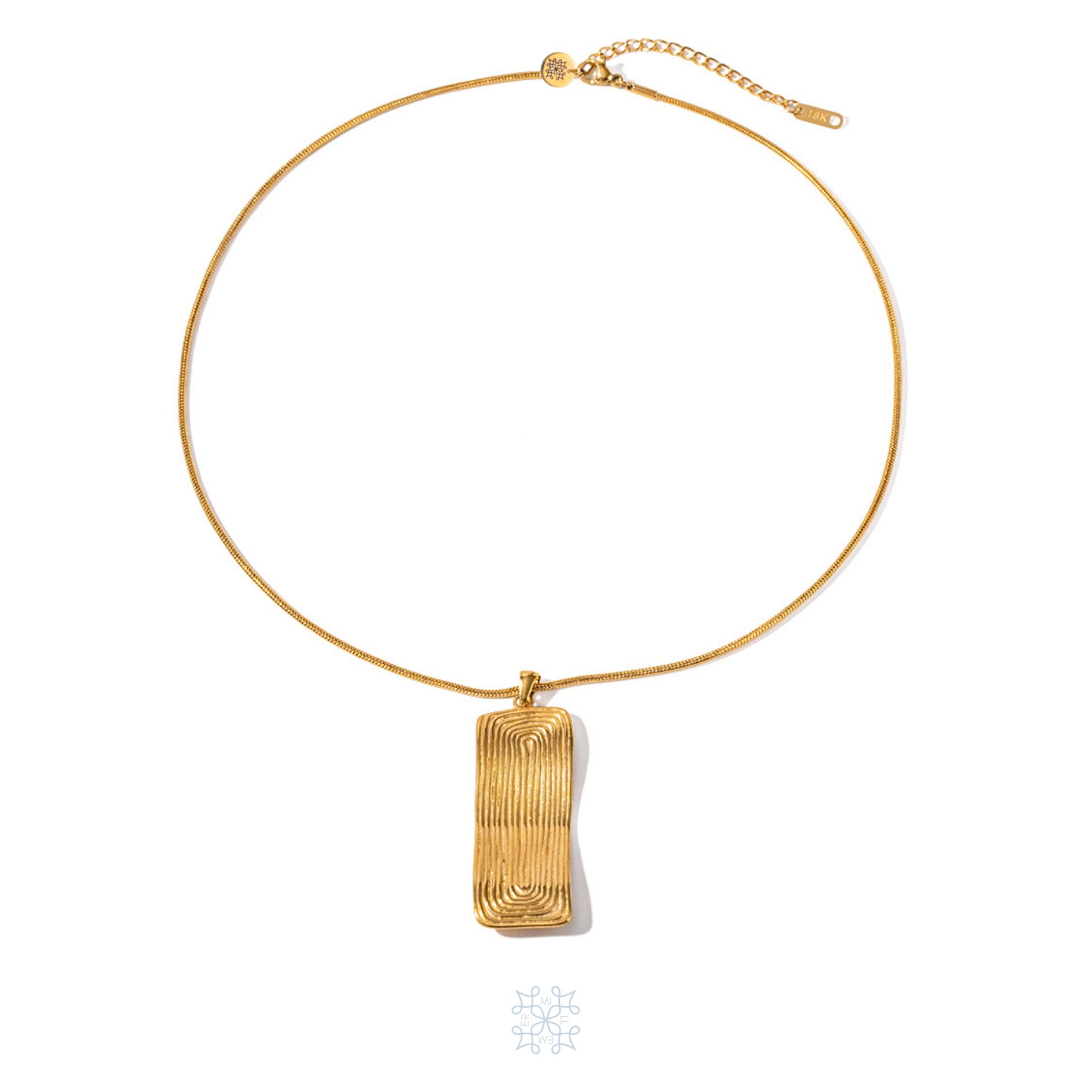 Gold plated chain necklace. An irregular shape bold  rectangular pendant drops on the chain. Circular oval shape are engraved on the pendant. Maya pendant gold necklace.