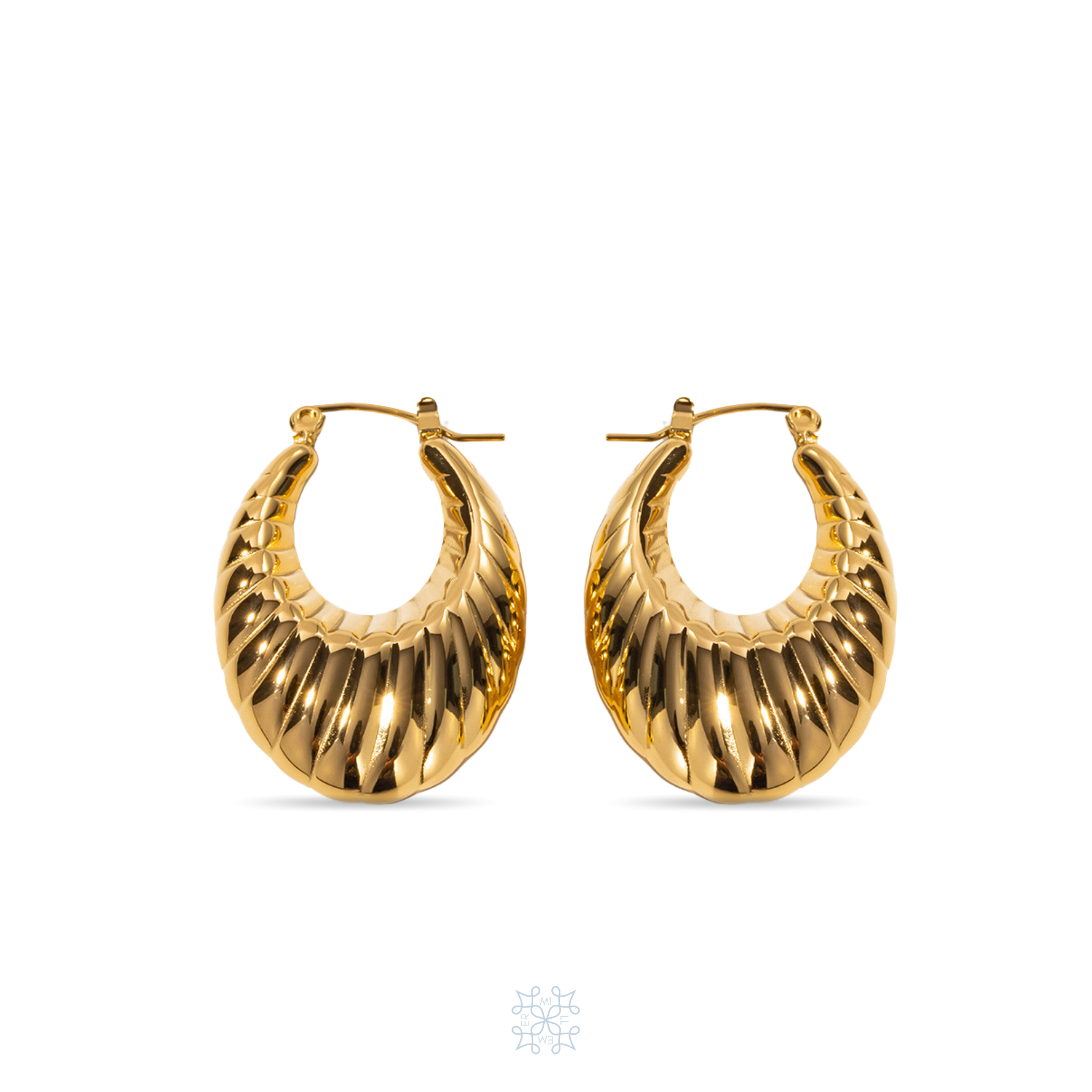 MELONI Earrings. Oval shaped gold hoop earrings. Chunky look in the bottom part of the oval.