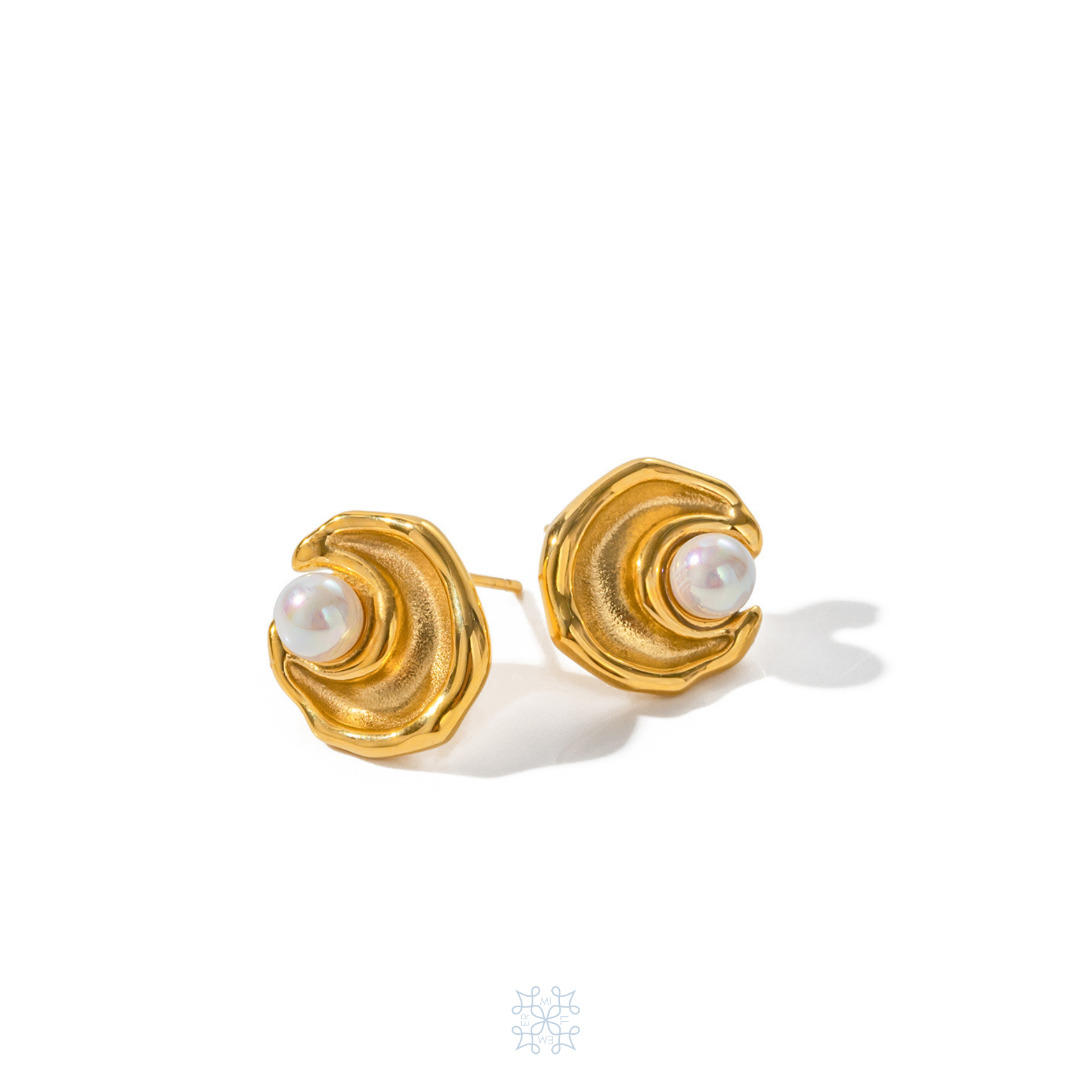 Gold Pearl Studs in the shape of a draper moon with a white pearl on the inside part of the moon. Moon Pearl Gold Stud Earrings.