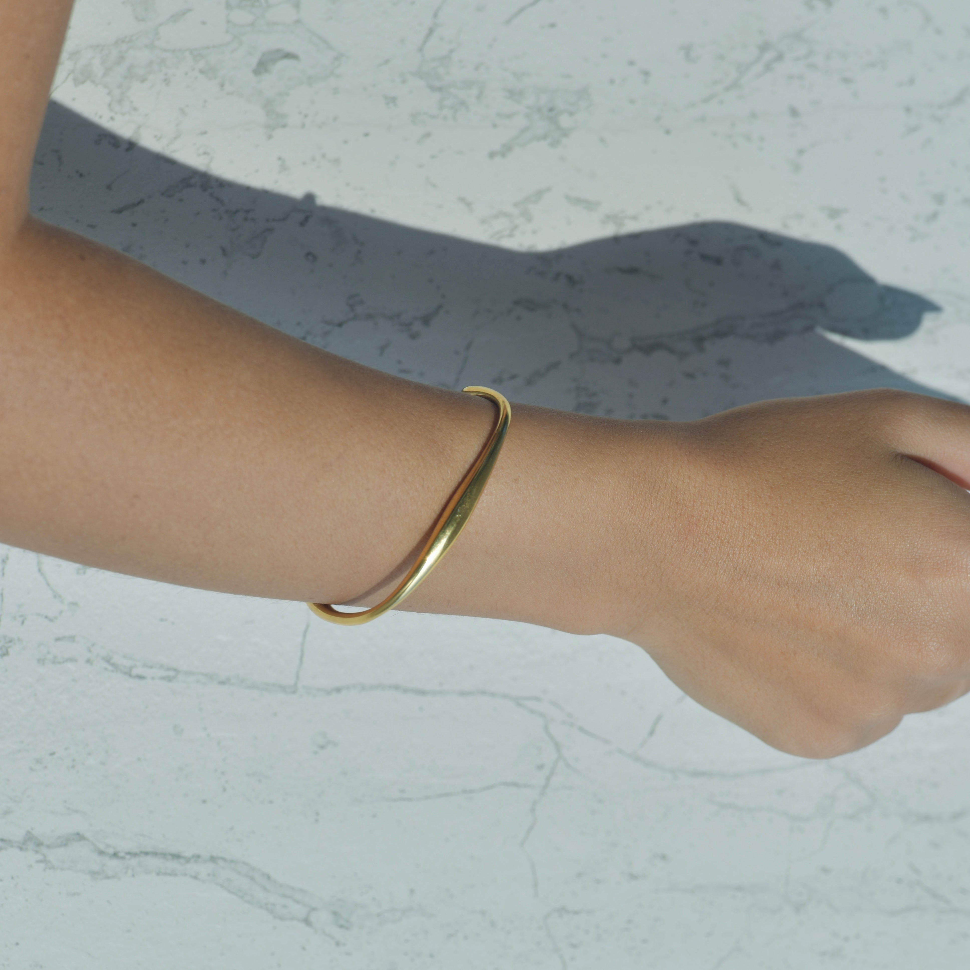 RAY Gold Cuff Bracelet. Cuff Gold metal bracelet with adjustable opening.