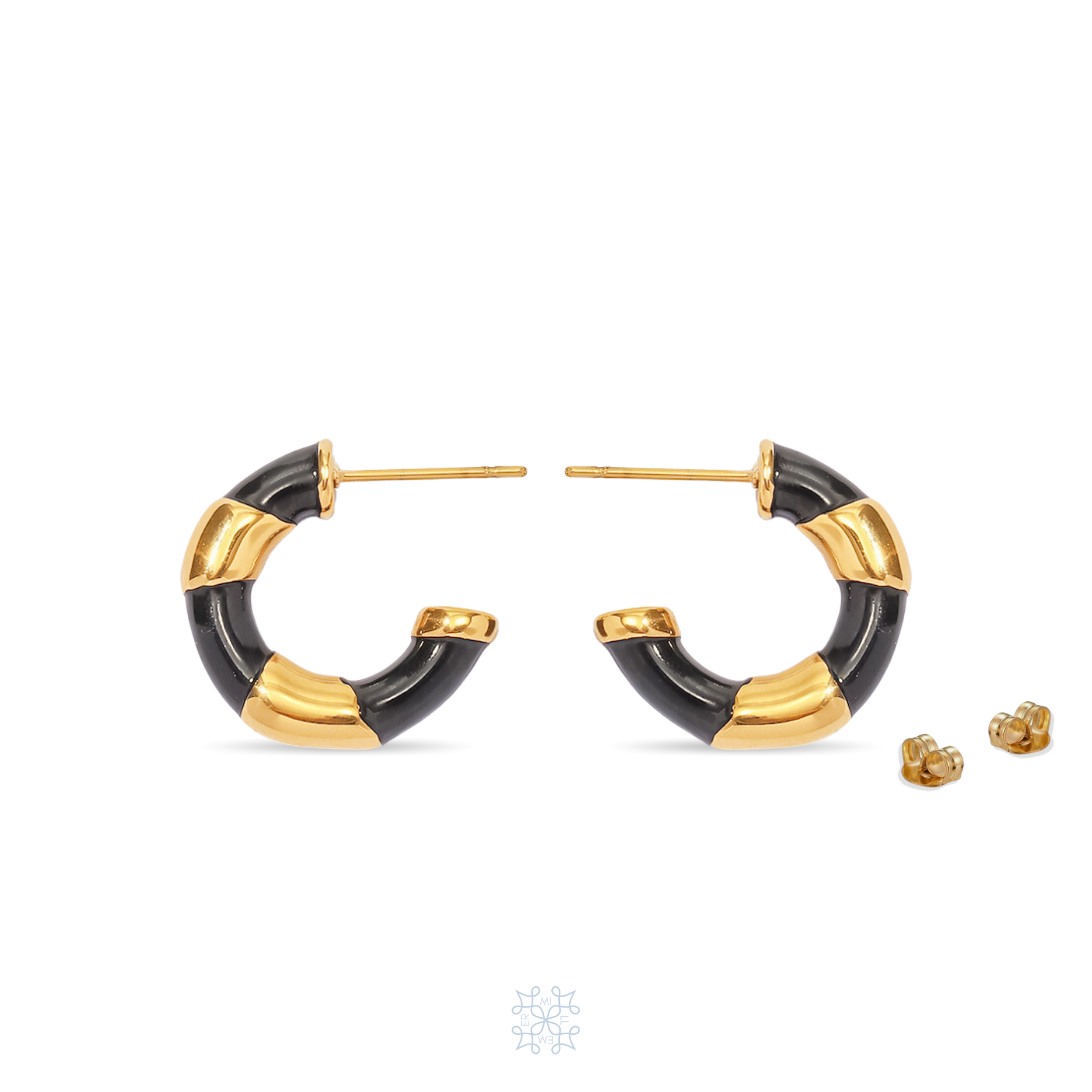 Gold hoop earrings painted with black enamel like a twisted ribbon around the gold hoop creating a two coloured hoop, black and gold hoop. RUBAN Black Hoop Gold Earrings.