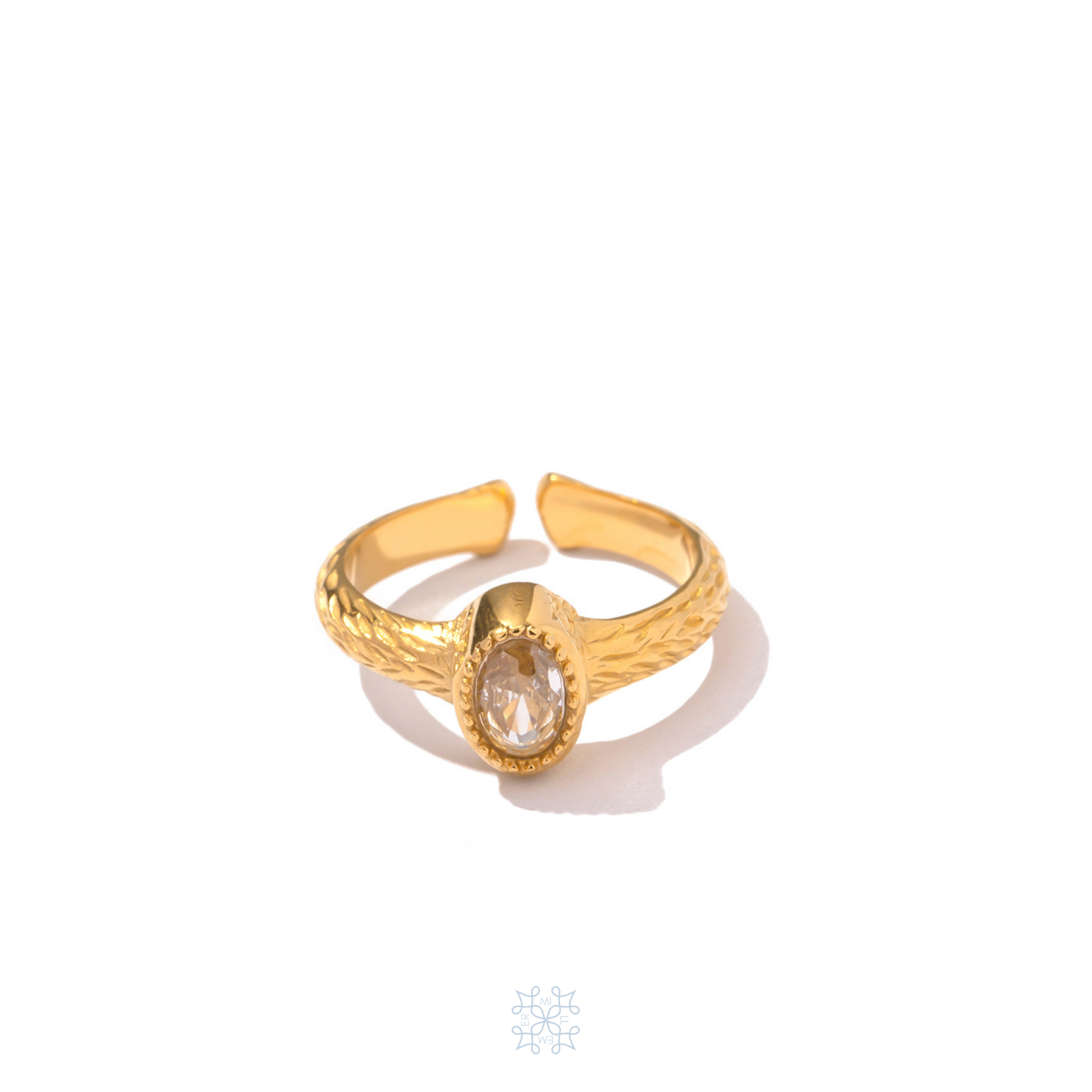Gold plated adjustable ring with a honey colour oval zircon ring. gold  irregular texture of the ring.