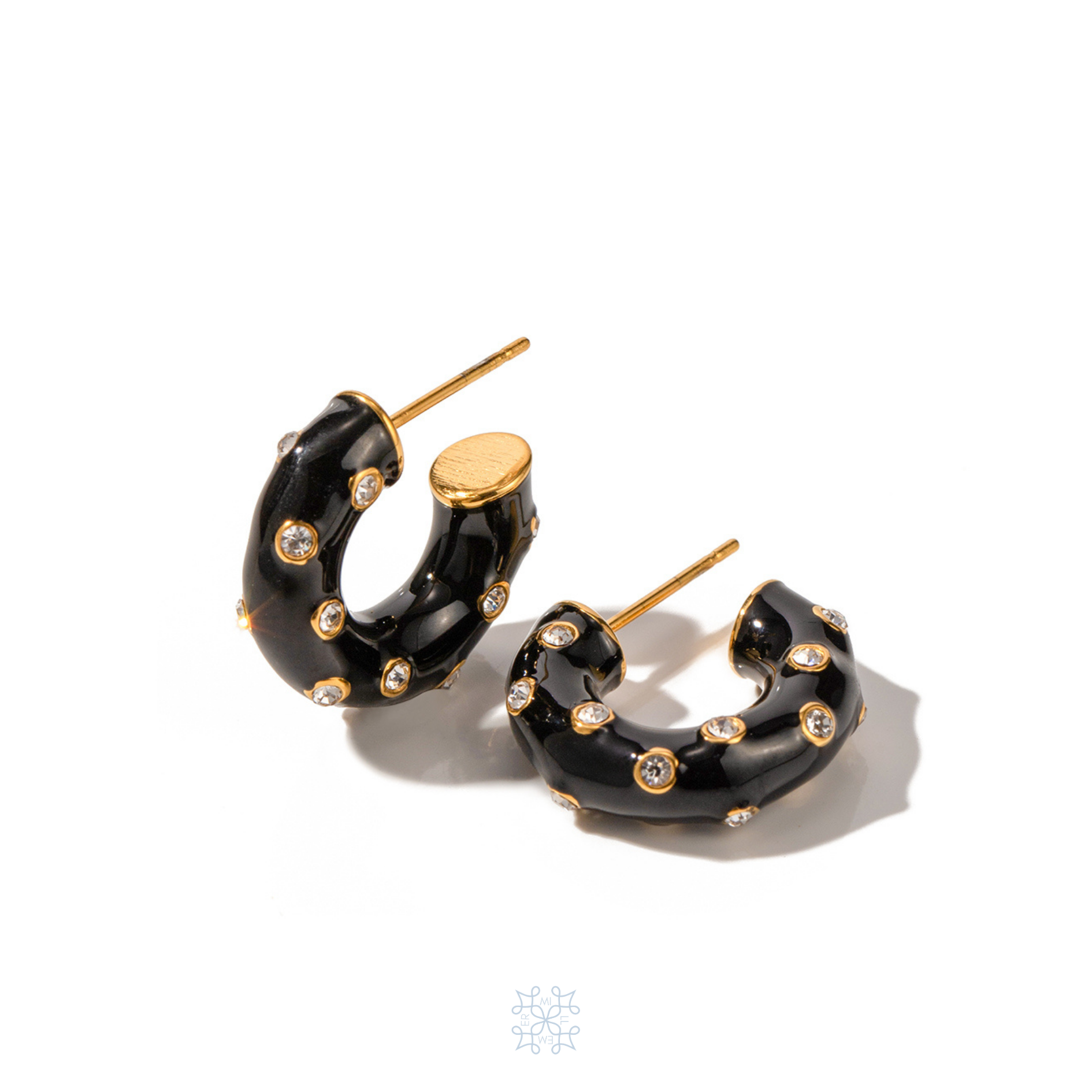 Gold plated Hoop Earrings painted with black enamel and adorned with zircons. 