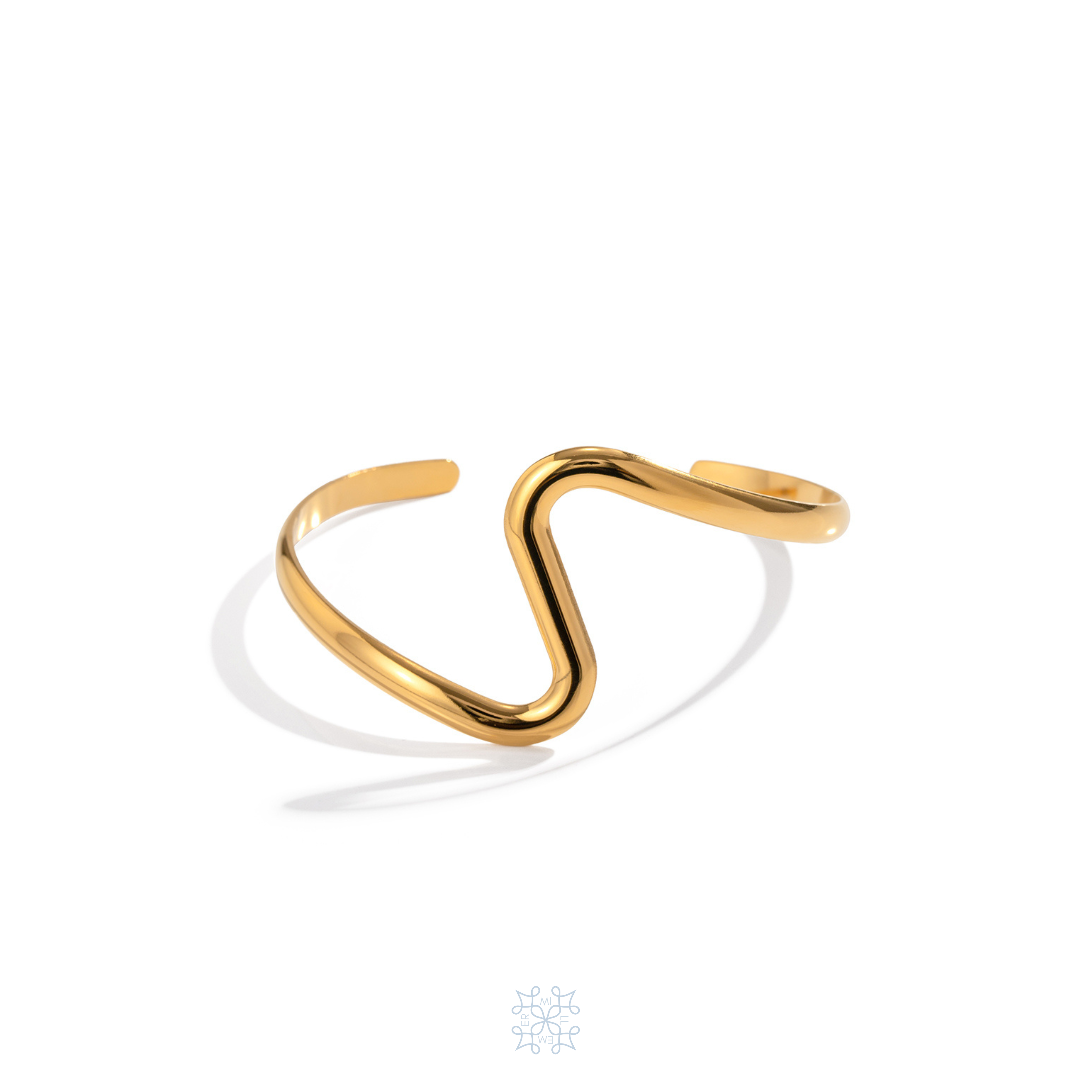 Tidal Cuff Gold Bracelet. Elegant cuff bracelet with a wave shape in the middle of the bracelet.