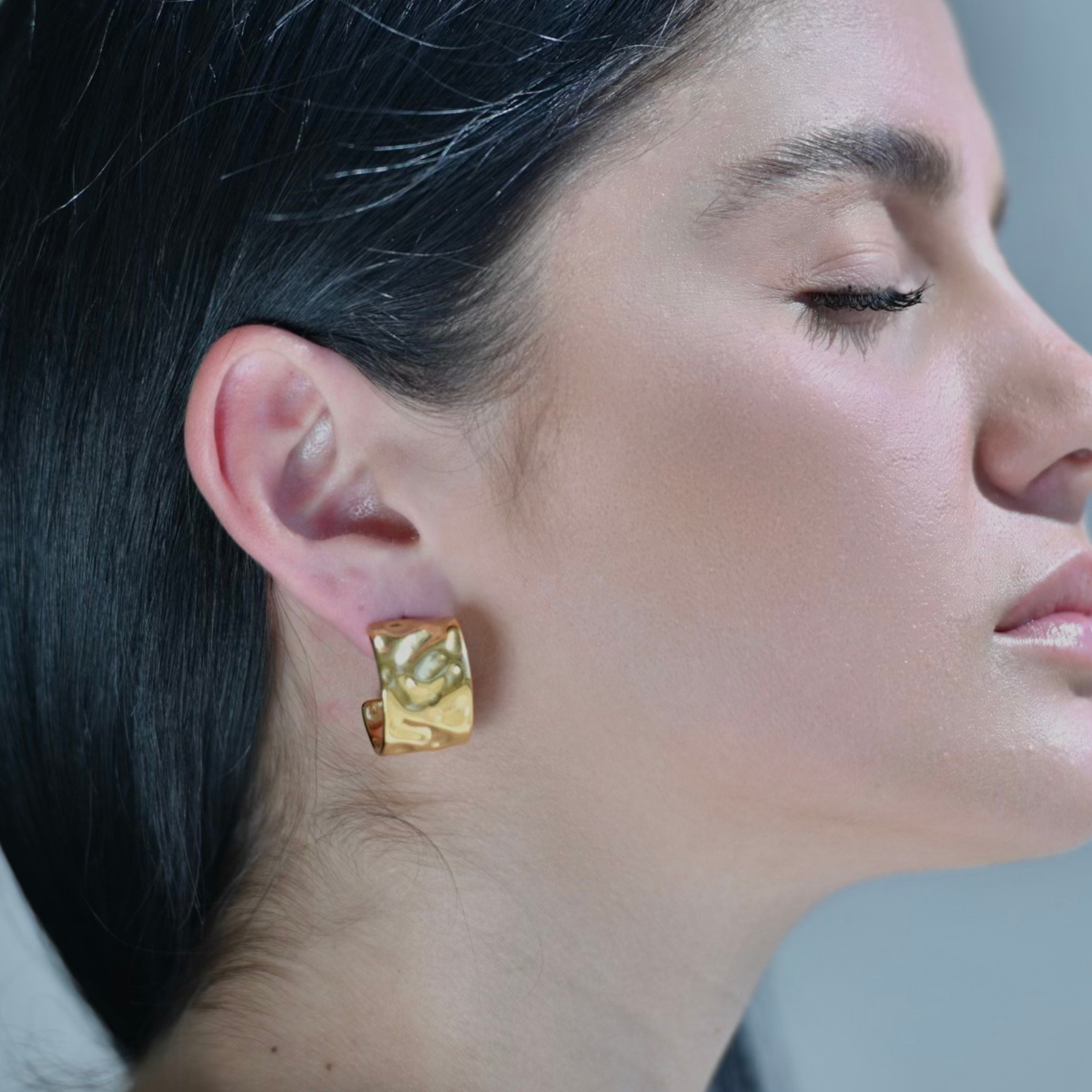 WAVE Gold Hoop Earrings with a slightly hammered surface.